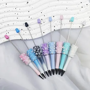 Detailed view of colorful handmade sugar pearl beaded pens with crystal and pearl accents