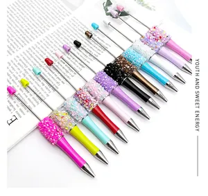 Colorful DIY beaded ballpoint pens with glitter sequins and bead decoration