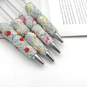 Bolígrafos creativos de cuentas con diamantes de imitación luminosos y lindos dijes 3D