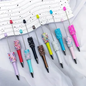 Assortment of DIY pastel beaded ballpoint pens with sparkly glitter sequins and rhinestones