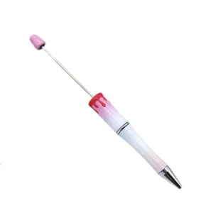 Halloween beaded ballpoint pen with blood drip effect and glitter gradient finish.