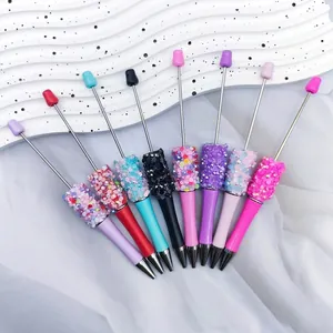 Set of 8 colorful DIY sequin beaded ballpoint pens with decorative shiny barrels.