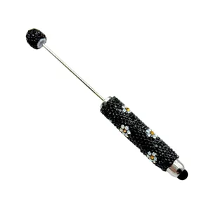Elegant black rhinestone stylus pen featuring white daisy patterns for touchscreen devices