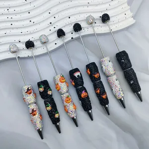 Halloween DIY beaded ballpoint pens with sparkly rhinestone pumpkin and ghost designs