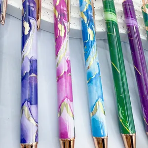 Collection of marble pattern metal ballpoint pens with elegant rose gold accents