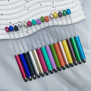 Collection of fifteen colorful beadable stylus pens for DIY crafting on white wavy display stand