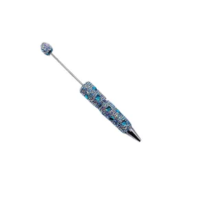 Stylo à bille perlé avec strass brillants, cristaux bleus et pointe métallique argentée élégante