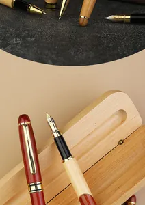 Macro view of a handcrafted wooden fountain pen nib and polished storage case