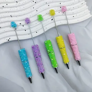 Set of five colorful heart-patterned beaded ballpoint pens with iridescent beads.