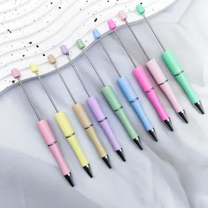 Close-up of a 10-piece set of colorful DIY beadable ballpoint pens in pastel tones.