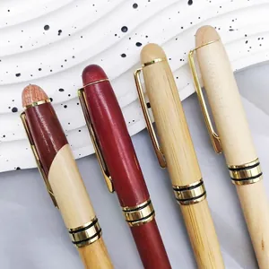 Professional wooden ballpoint pens in bamboo and rosewood finishes with gold accents