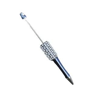 Elegant beaded ballpoint pen with blue gradient finish and pearl rhinestone grip detail