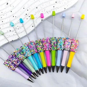 Detailed view of colorful sprinkle-decorated beadable pens in assorted pastel colors