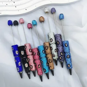 Luxury leopard print rhinestone beaded ballpoint pens in multiple vibrant colors and textures