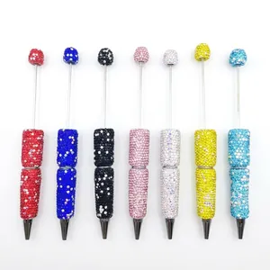Set of full diamond beaded ballpoint pens with colorful rhinestones on white background