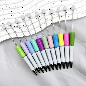 Set of eleven colorful beadable plastic ballpoint pens for DIY crafting projects
