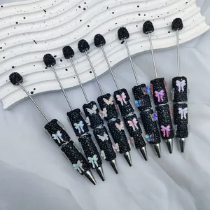 Elegant DIY rhinestone ballpoint pens with colorful butterfly charms for journaling