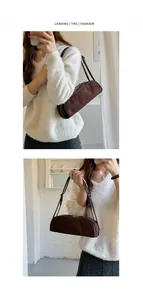 Brown suede bowling bag shown in a lifestyle setting for shoulder or hand carry.