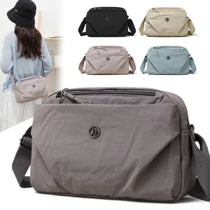 Bolso bandolera pequeño y ligero de nailon con dos compartimentos, varios colores disponibles
