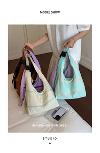 Detailed view of fashionable hobo shoulder bags in multiple colors for women's style