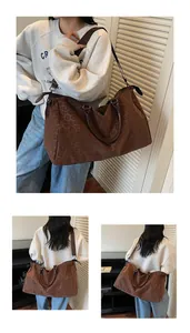 Large leopard print travel tote bag worn as a shoulder and crossbody bag by model