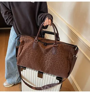 Brown leopard print large capacity travel duffel bag with handles and shoulder strap