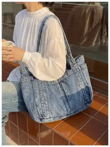 Bolso tote de mezclilla azul con bolsillos, ideal para la escuela o uso diario casual