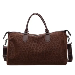 Large brown leopard print travel duffel bag with shoulder strap