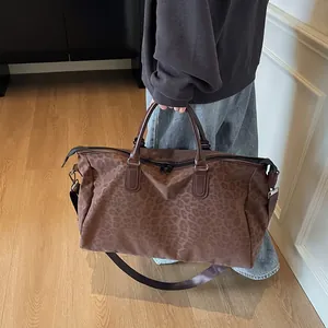Stylish large capacity leopard print travel duffle bag for women with shoulder strap