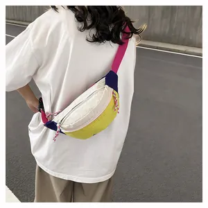 Detailed back view of a colorful dopamine style crossbody bag with grid texture worn by model