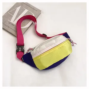 Detailed view of the vibrant multi-colored dopamine fanny pack with grid patterns