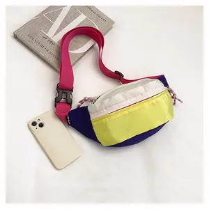 Vibrant dopamine-style nylon chest bag with grid texture and hot pink shoulder strap