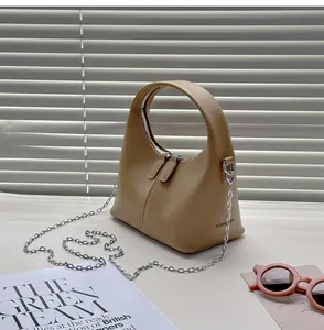 Chic beige PU leather handbag with elegant chain strap and integrated top handle