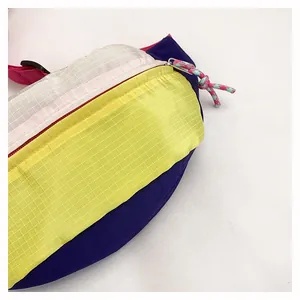 Close-up of colorful dopamine style chest bag with durable ripstop nylon grid texture