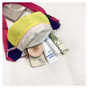 Detailed view of colorful dopamine crossbody bag interior showing storage capacity