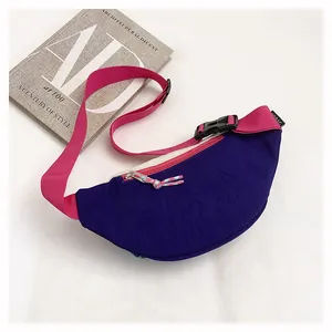 Detailed side view of a purple and pink dopamine style lightweight nylon crossbody bag