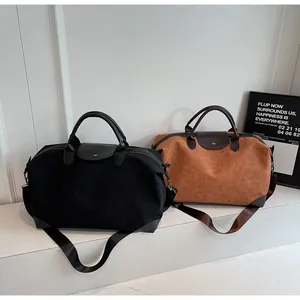 Premium vintage suede travel duffel bags in black and brown with durable leather handles