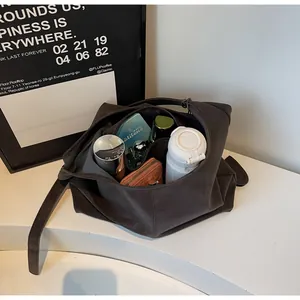 Interior detail of the dark brown minimalist retro shoulder bag showing its capacity