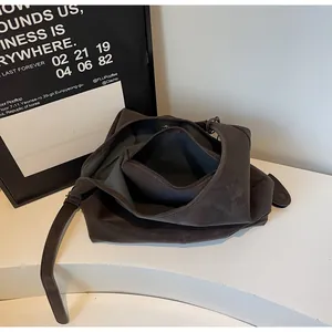 Interior detail of a minimalist vintage dark brown faux leather tote bag with zip pocket