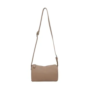 Vintage minimalist PU leather cylinder shoulder bag in taupe with adjustable strap