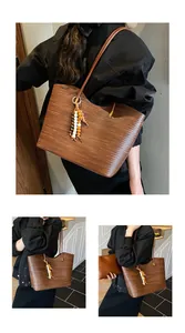 Chic brown woven shoulder bag with beaded tassel shown in lifestyle settings
