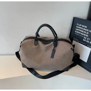Detailed side view of a large-capacity two-tone travel bag in brown and black.
