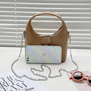 Vintage tan PU leather crescent handbag with a silver chain strap and top handle