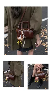 Versatile dark brown glossy Boston bag shown in multiple lifestyle angles outdoors.