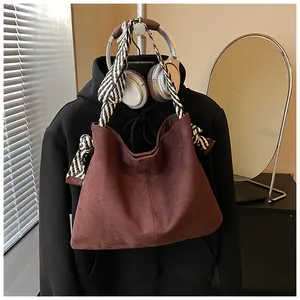 Large vintage frosted suede tote bag featuring a stylish woven shoulder strap.