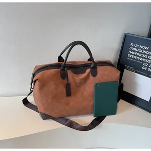Large brown faux suede travel tote bag shown with tablet for size scale and texture detail