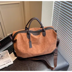 Large capacity two-tone travel duffel bag with crossbody strap and vintage leather texture.