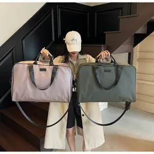 Professional large capacity travel duffel bags in mauve and olive green colors