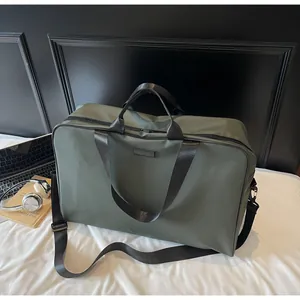 Spacious olive green travel duffel bag with shoulder strap for gym and short trips