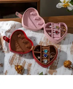 Detailed view of heart-shaped jewelry boxes with soft flocking interior slots